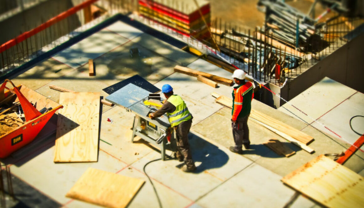 Construction workers working at building site