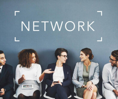 people networking under the word network on the wall